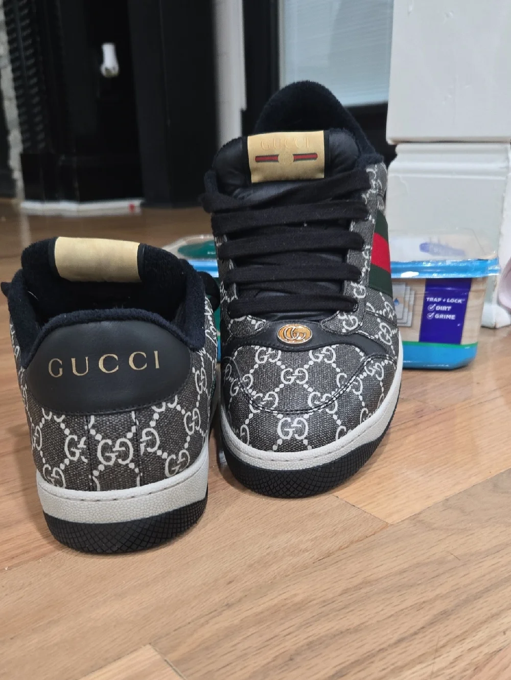 Gucci Black and White GG Monogram Low-Top Sneakers with Gold Accents
